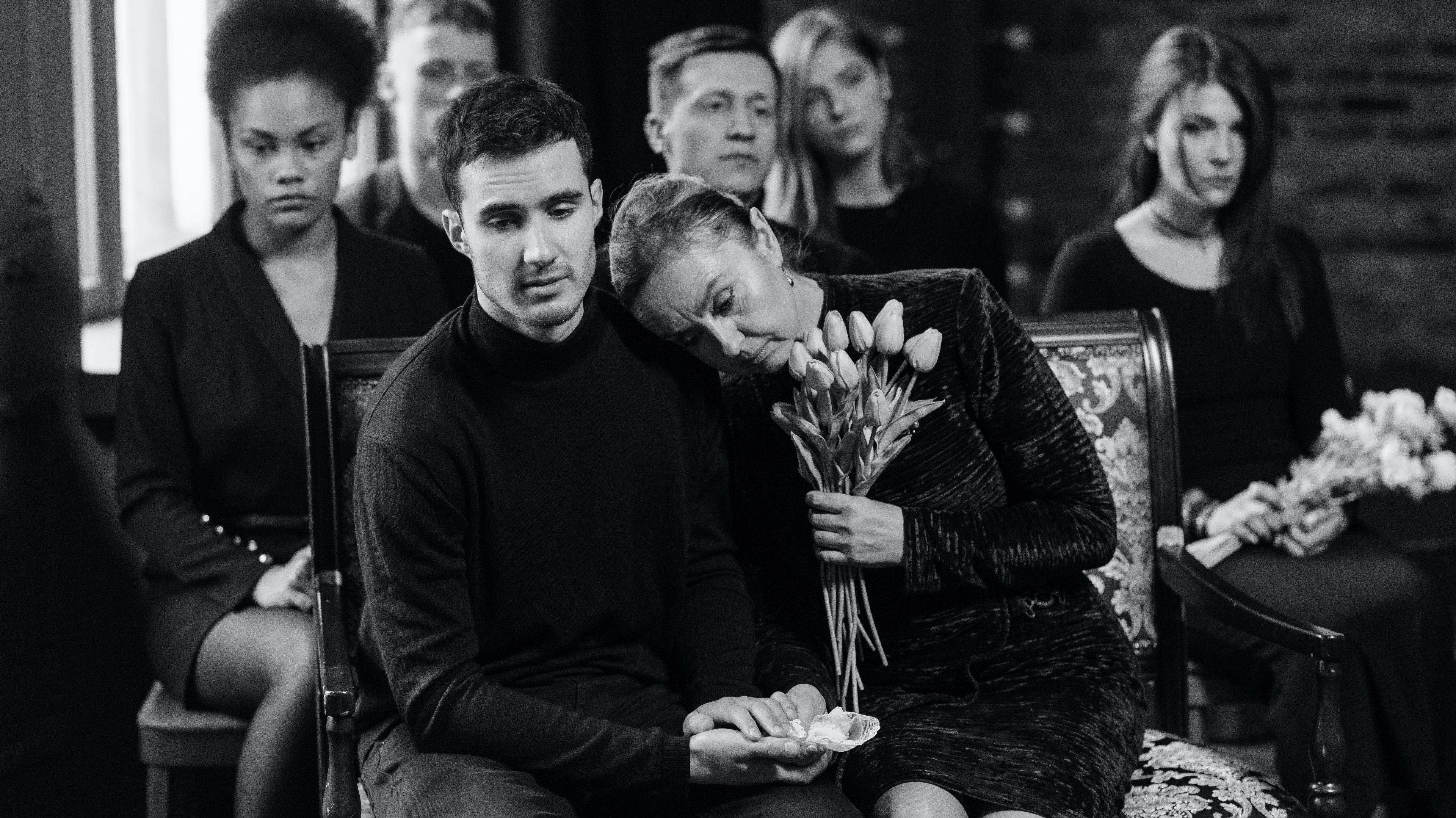 family grieving black and white photo