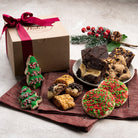 Dulcet Christmas gift box with decorated Christmas tree cookies, red and green sprinkle cookies, assorted chocolate brownies and gourmet rugelach.