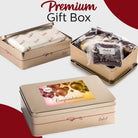Dulcet gold congratulations gift tin showcasing individually wrapped gourmet brownies, branded tissue paper, and a celebratory lid featuring gold and pink balloons.
