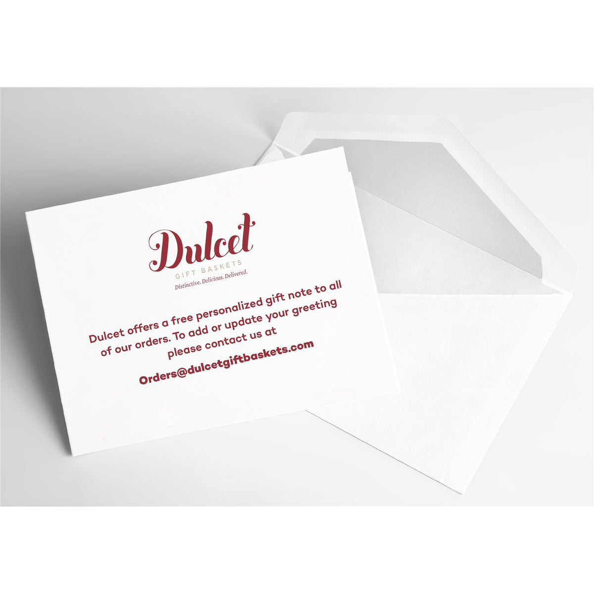 Dulcet Gift Baskets personalized gift note card with white envelope, featuring complimentary greeting message instructions and customer service email.