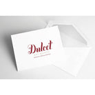 White Dulcet Gift Baskets greeting card with branded logo and matching envelope for adding a personalized message to gift deliveries.