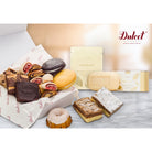 Dulcet luxury gift assortment featuring gourmet brownies, assorted rugelach, chocolate and lemon whoopie pies, crumb cakes, glazed mini Bundt cake, Thymes Goldleaf body cream and scented soap.