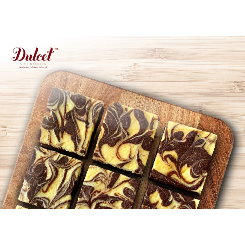 Dulcet chocolate cheesecake brownie squares with creamy vanilla cheesecake swirls over a rich chocolate base, arranged on a wooden cutting board.