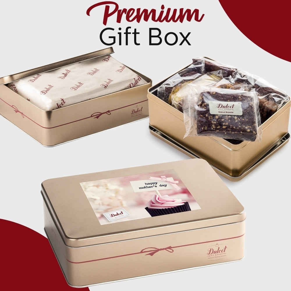Dulcet premium Mother's Day gift box featuring elegant gold tins, a pink cupcake-themed greeting label, individually wrapped walnut brownies and assorted gourmet bakery treats.