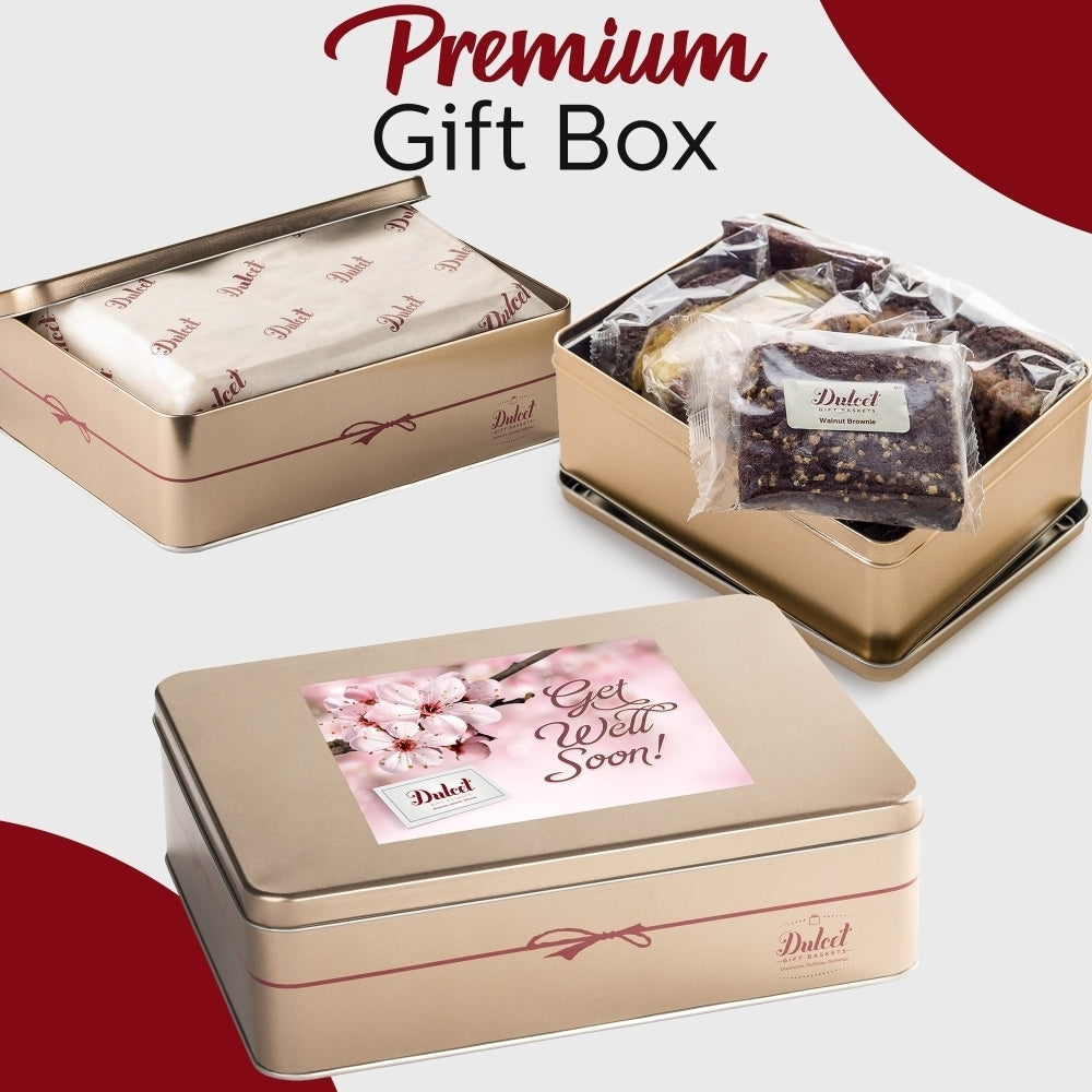 Dulcet premium Get Well Soon gift box featuring elegant gold tins, floral packaging, individually wrapped brownies and assorted gourmet bakery treats.