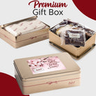 Dulcet premium Get Well Soon gift box featuring elegant gold tins, floral packaging, individually wrapped brownies and assorted gourmet bakery treats.