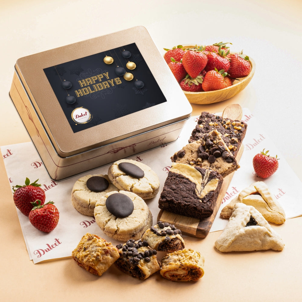 Dulcet holiday gourmet gift tin with Happy Holidays packaging, assorted brownies, chocolate cookies, hamantaschen and rugelach.
