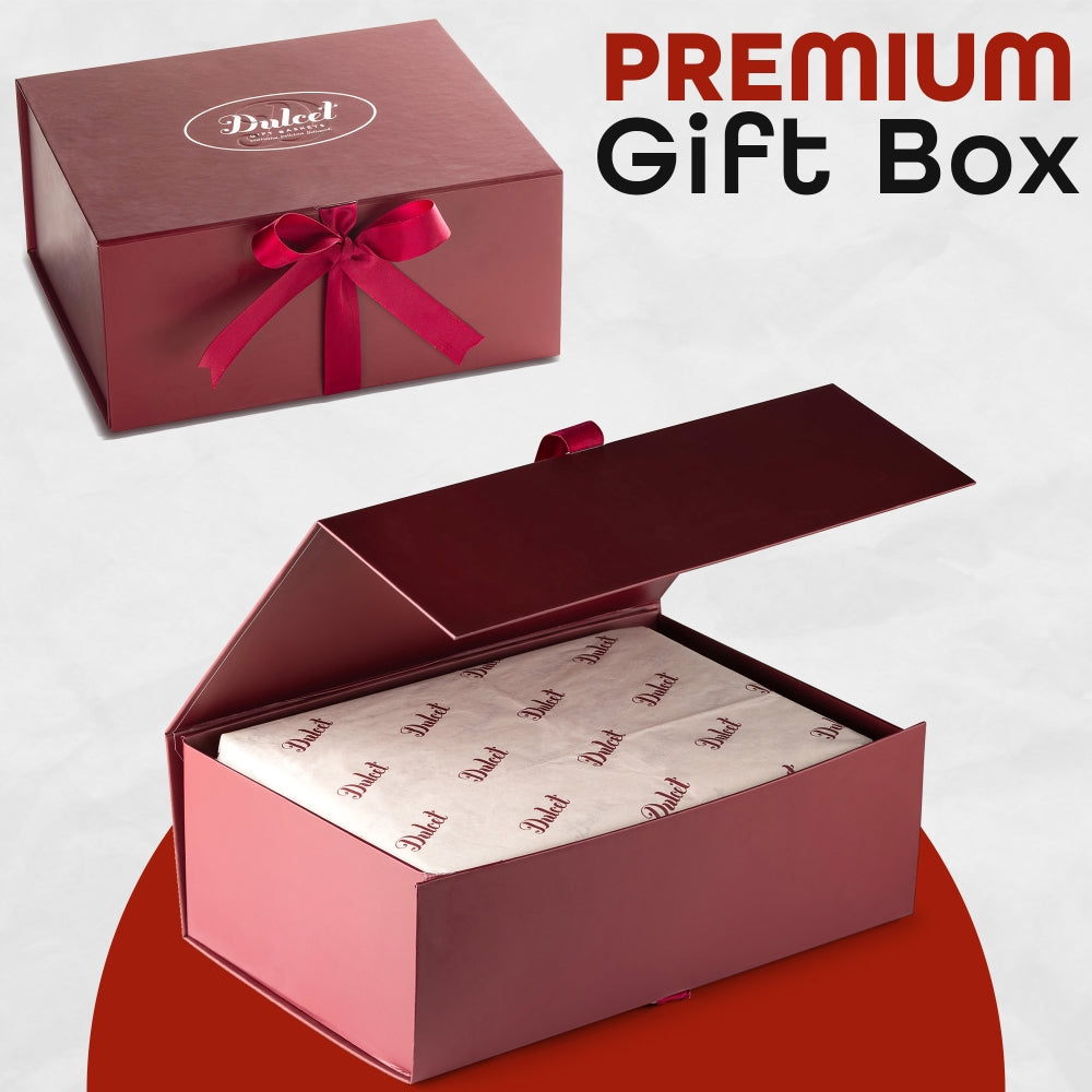Premium burgundy Dulcet gift box with elegant ribbon bow, magnetic-style lid and branded tissue paper, ideal for luxury and corporate gifting.
