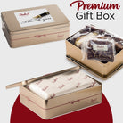 Dulcet premium Thank You gift tin shown closed, open with individually wrapped gourmet brownies and bakery treats, and sealed with branded tissue paper.