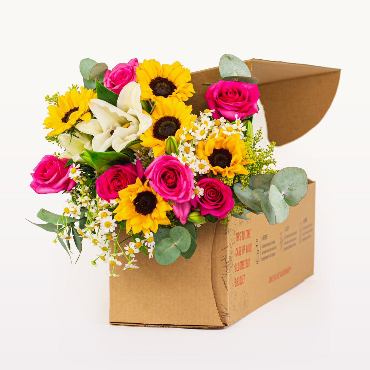 Sunshine Medley sunflower and rose bouquet featuring yellow sunflowers, pink roses, white lilies and daisies in a flower delivery box.