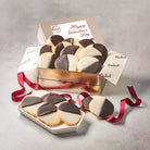 Dulcet Valentine's Day gold gift tin filled with chocolate and vanilla iced black and white cookies, displayed with burgundy ribbon and a decorative Valentine's Day lid.