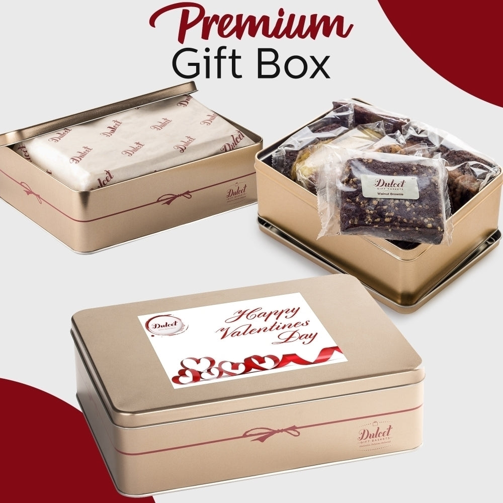 Dulcet Valentine's Day gold gift tin showcasing individually wrapped gourmet brownies, branded tissue paper, and a decorative lid with red hearts and a romantic greeting.