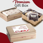 Dulcet Valentine's Day gold gift tin showcasing individually wrapped gourmet brownies, branded tissue paper, and a decorative lid with red hearts and a romantic greeting.