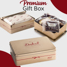 Dulcet premium gold gift tin shown open with individually wrapped bakery treats and closed with its branded lid.