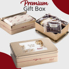 Dulcet Thinking of You gold gift tin displayed open with individually wrapped bakery treats and closed with a decorative leaf lid.